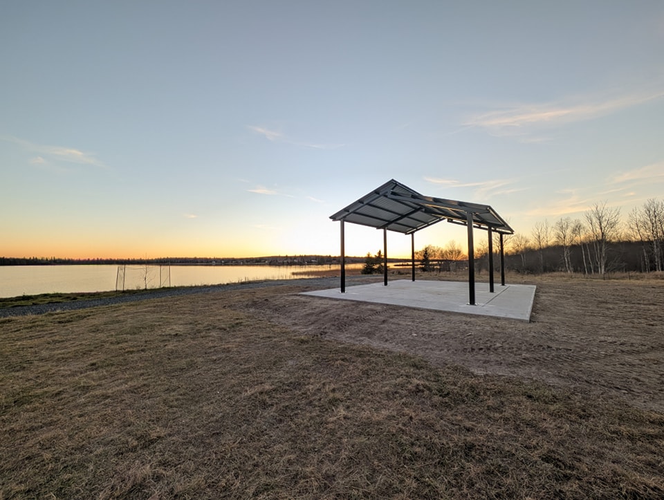 A pavilion on the Wabigoon shoreline overlooking a sunset.