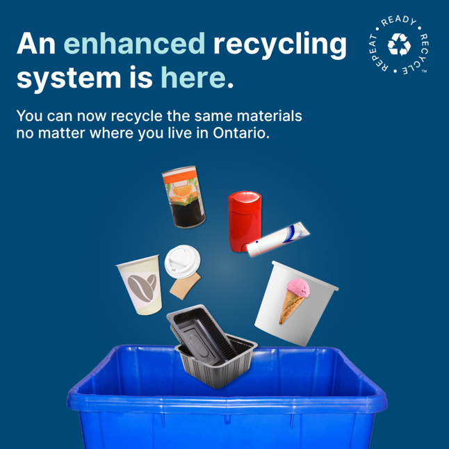 Image of a recycling bin saying "An enhanced recycling system is here"